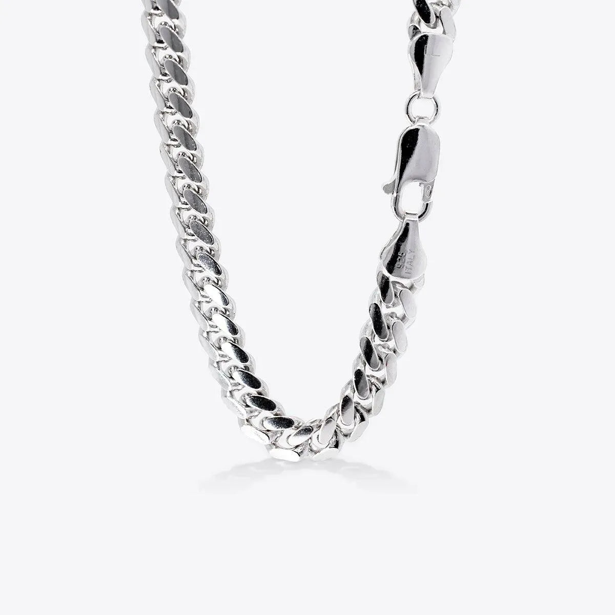 A detailed view of the Simply Silver- Unisex Link Necklace from the silver collection against a white backdrop, highlighting the clasp on the right, perfect piece to complement an initial necklace.