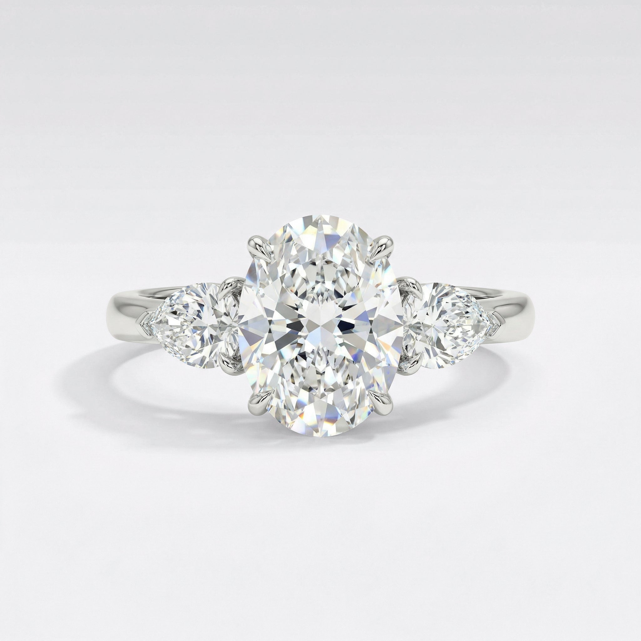 The Classic Three Stone Engagement Ring with Hidden Halo